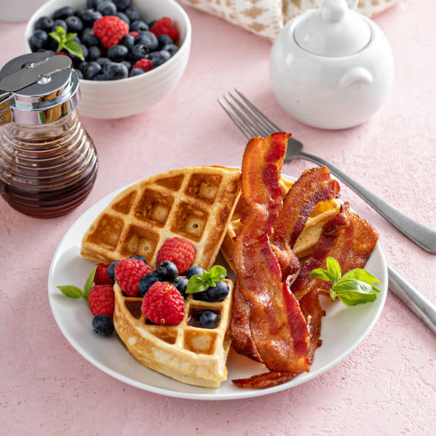 istock Belgian waffles with bacon and fresh berries for breakfast 1411524587