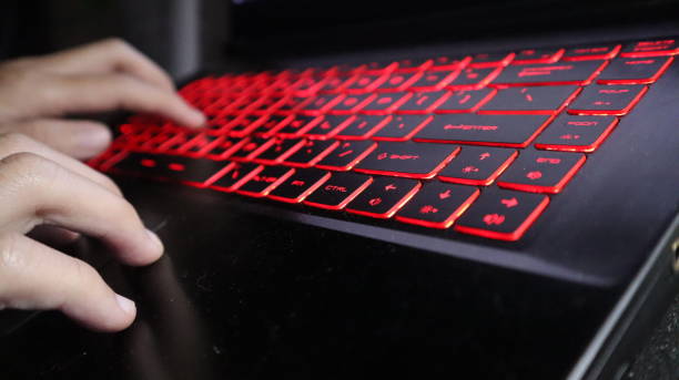 Red-glowing keyboard for the process of sending messages
