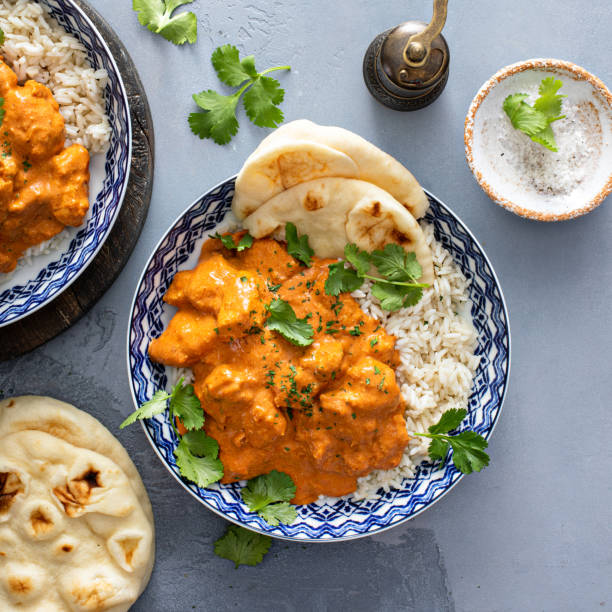 istock Chicken tikka masala, cooked marinated chicken in spiced curry sauce 1411524623