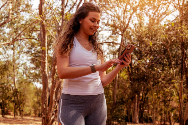 istock Young woman trading in a public park 1411529938