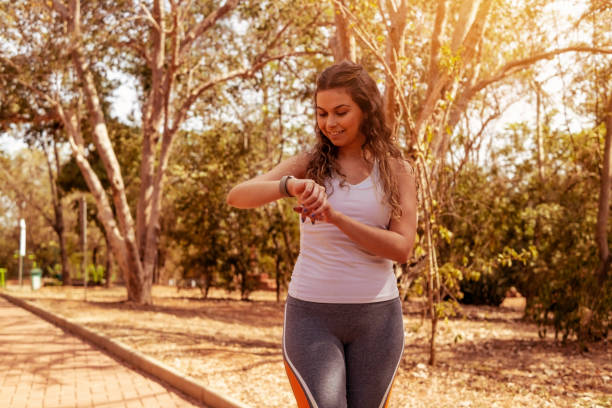 istock Young woman trading in a public park 1411530198