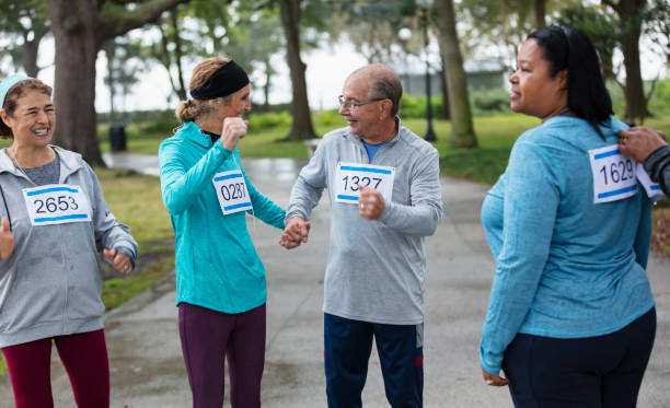 istock Couple with friends getting ready to run a race 1411532873