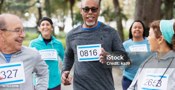 Senior Africanamerican Man Running In A Race Stock Photo - Download Image Now - Sports Race, Running, Senior Adult