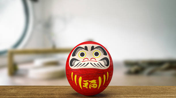 istock daruma Japanese doll on wood table 3d rendering 1411533968