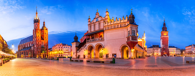 Krakow, Poland. Twilight scenic panorama with Ryenek Square, historical Cracovia. Bazylika Mariacka, Cloth Hall and Town Hall Tower