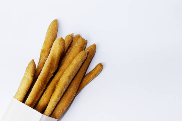 Italian grissini in a napkin on a white background