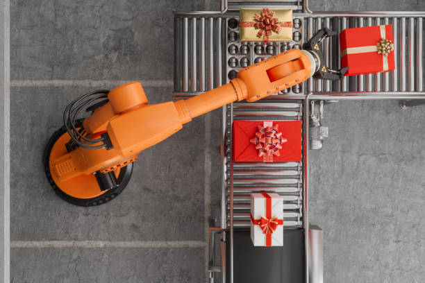 istock Top View Of Robotic Arm And Gift Boxes On Conveyor Belt 1411545758