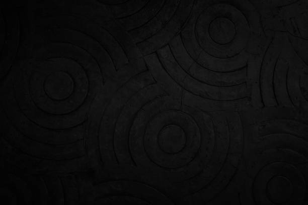 Black concrete texture wall background. Abstract dark paint floor stamped concrete surface clean polished on walkway in garden. Wallpaper cement stone pattern curved circle rough gray decorative room.