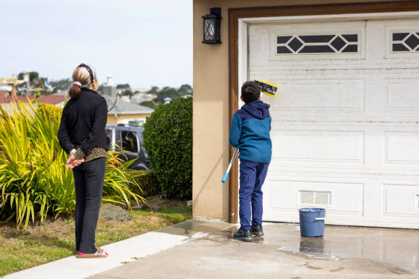 istock Grandson Helping Grandmother Paint 1411546719