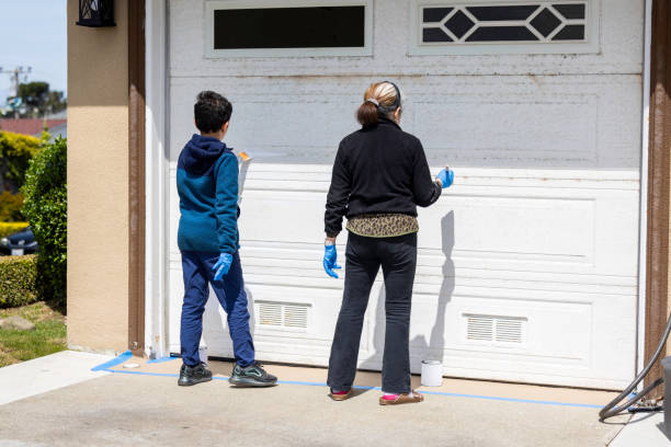 istock Grandson Helping Grandmother Paint 1411546796