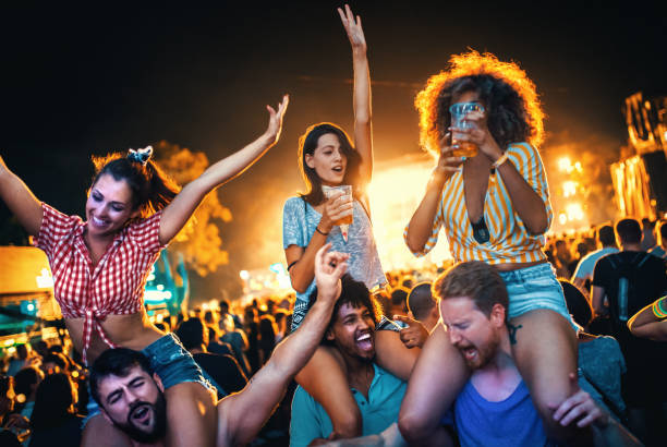 Young people dancing at a concert.