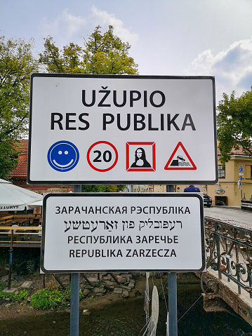 Vilnius, Lithuania - August 10, 2019: Republic of Uzupis Sign at the entrance to the Streets of the unadmitted republic of Uzupis in Vilnius. Uzupis is a neighborhood in Vilnius, the capital of Lithuania, largely located in Vilnius' old town.