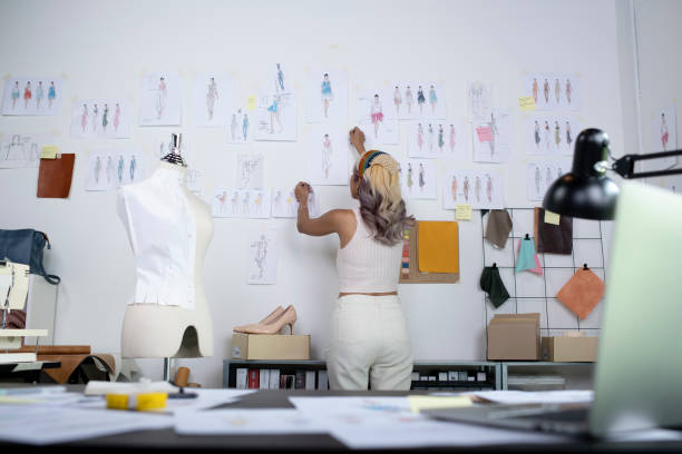 istock Asian woman tailor in seamstress studio. 1411554977