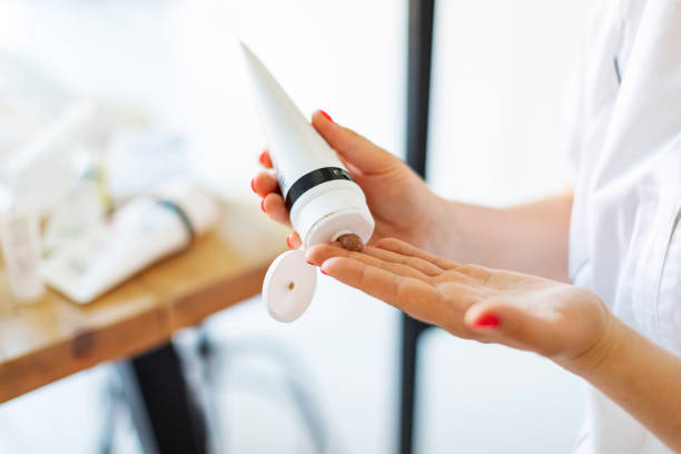 istock Cosmetologist making face massage at home 1411556954