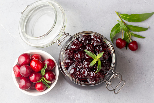 Jars with freshly homemade cherry jam, sour cherry jam, Turkish name; Visne receli