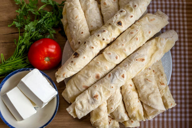 istock Traditional, local Turkish food; cheese pastry wrap (Turkish name; Sikma) 1411560456