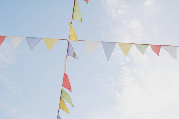 istock Festive colorful flags in the blue sky 1411563779