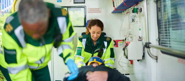 istock ambulance paramedics with casualty 1411564720