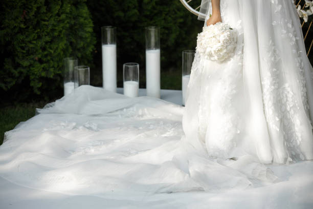 istock Bright wedding bouquet in hands of the bride 1411565773
