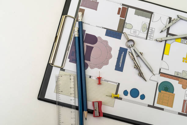 istock Floor plan of a house with work tool on desk 1411566284