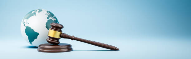 istock Judge's Gavel and Earth Planet on Blue Background 1411567007