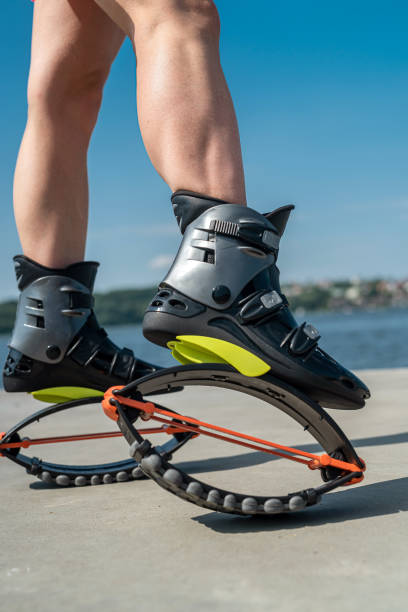 Male strømper Bliv sur Female Trainer Doing Exercises Jumping In The Kangoo Jumps Boots Stock  Photo - Download Image Now - iStock