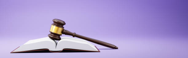 judge's gavel and an open book on purple background - intellectual property law patent book imagens e fotografias de stock