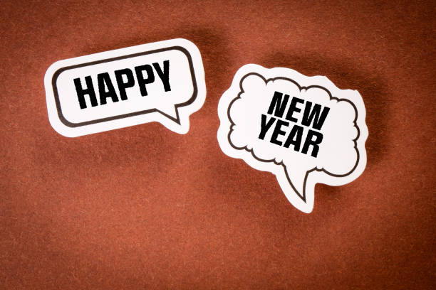 istock Happy New Year. Speech bubbles on a brown background 1411567561