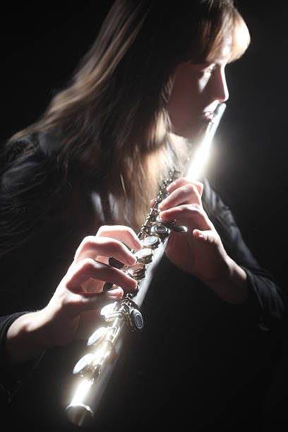istock Flute playing flutist classical musician 141156929