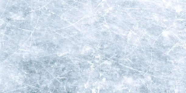 Photo of Natural scratched ice at the ice rink as texture or background for winter composition, large long picture