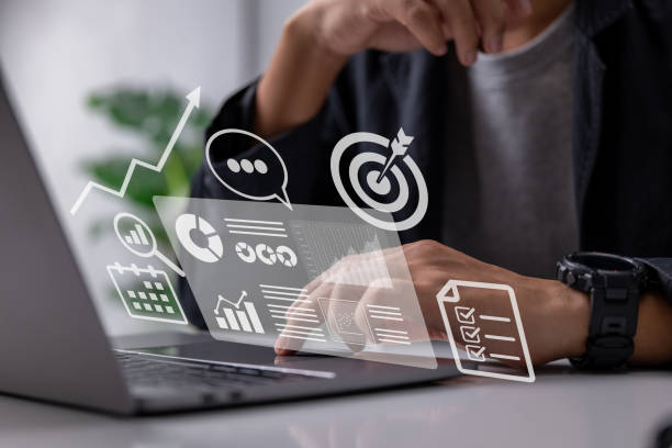 istock Accounting, analysis, audit, research, results. Laptop with graphs and charts on the screen, clipboard, report, target, calendar, magnifier. Financial Report. 1411570370