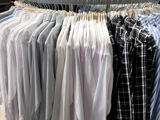 Business shirt button down clothing stacked in a pile