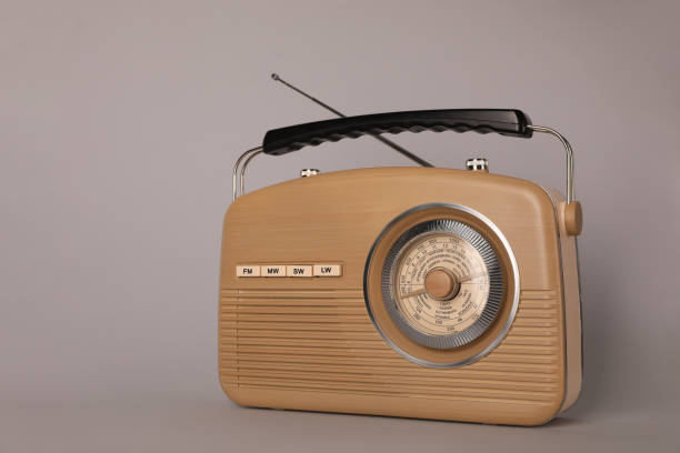 istock Portable retro radio receiver on grey background 1411571567