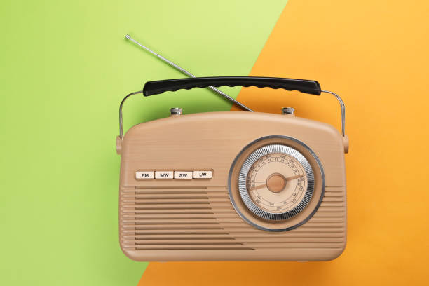 istock Retro radio receiver on color background, top view 1411572038