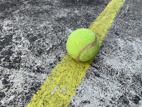 A tennis ball on a line