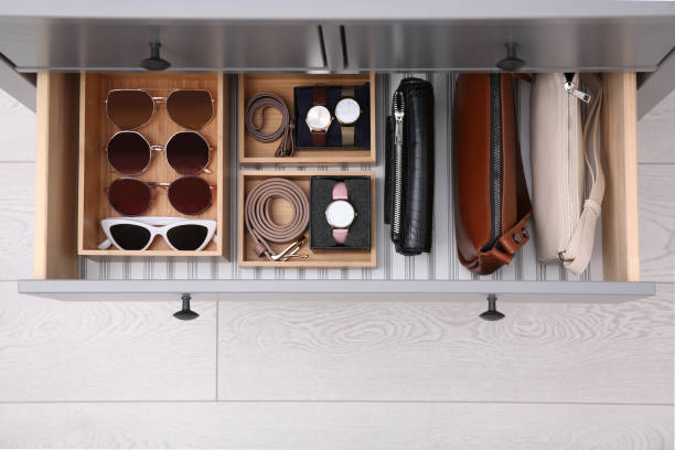 istock Open drawer with different stylish accessories indoors, top view. Storage and organizing 1411575743