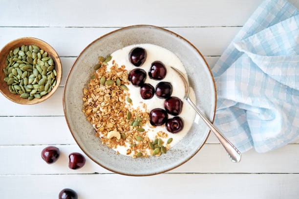 Curd cheese with granola and cherries