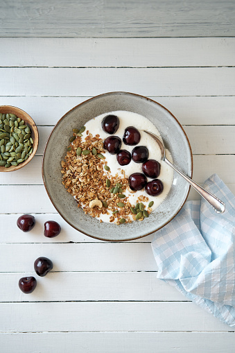 Curd cheese with granola, cherries and pumpkin seeds