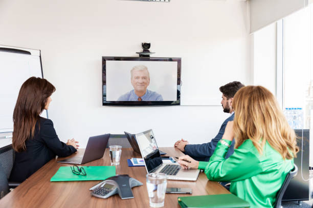 istock Business team having virtual meeting in boardroom 1411586285