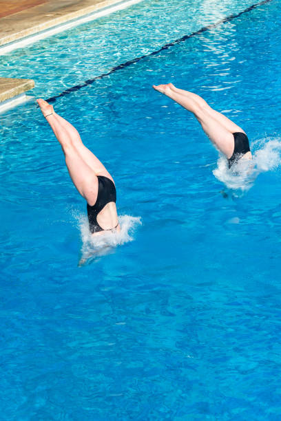 istock Aquatic Diving Doubles Girls Entry Splash Pool 1411586325