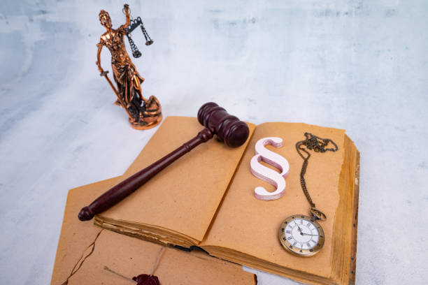 istock Notary's public pen and stamp on testament and last will. Notary public tools 1411587591
