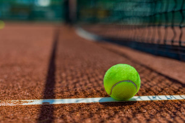 istock Tennis court with ball 1411588265