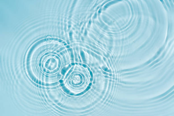 blue water texture, blue mint water surface with rings and ripples. spa concept background - rippled imagens e fotografias de stock
