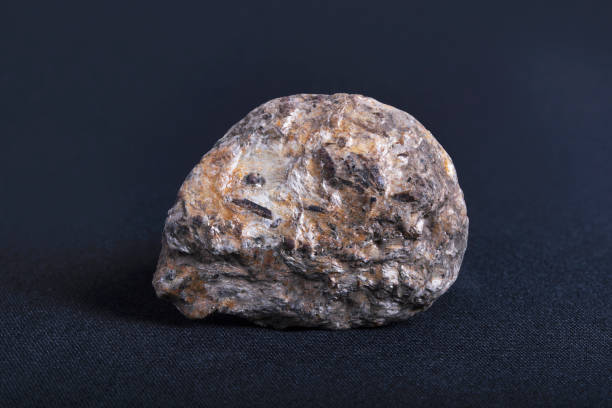 istock Gneiss with granite needle. Gneiss is a common and widely distributed type of metamorphic rock 1411596257