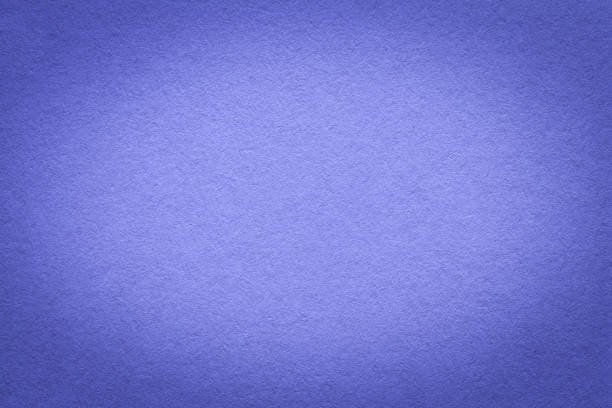 istock Texture of vintage very peri paper gradient background with dark vignette. Structure of dense craft navy blue cardboard 1411597385