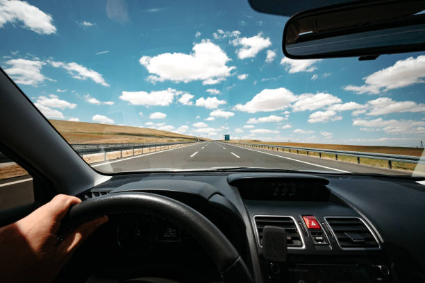 Point of view of driving on a empty highway stock photo