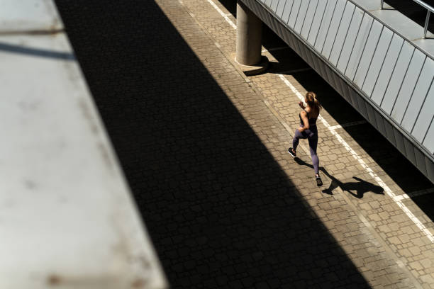 istock Woman runing in urban scene 1411598891