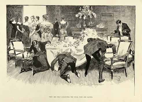 Vintage illustration of a men looking under the dinner table for womens lost gloves and fans, 1890s, Charles Dana Gibson