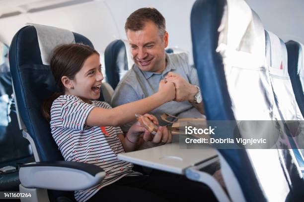 Happy Father And Daughter Having A Fist Bump When Sharing Sandwich Stock Photo - Download Image Now