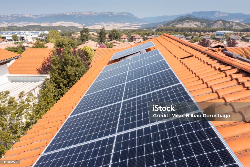Solar panels on a roof. Solar panels on a roof. Drone view. Navarre, Spain, Europe. Environment and technology concepts. Solar Panel Stock Photo